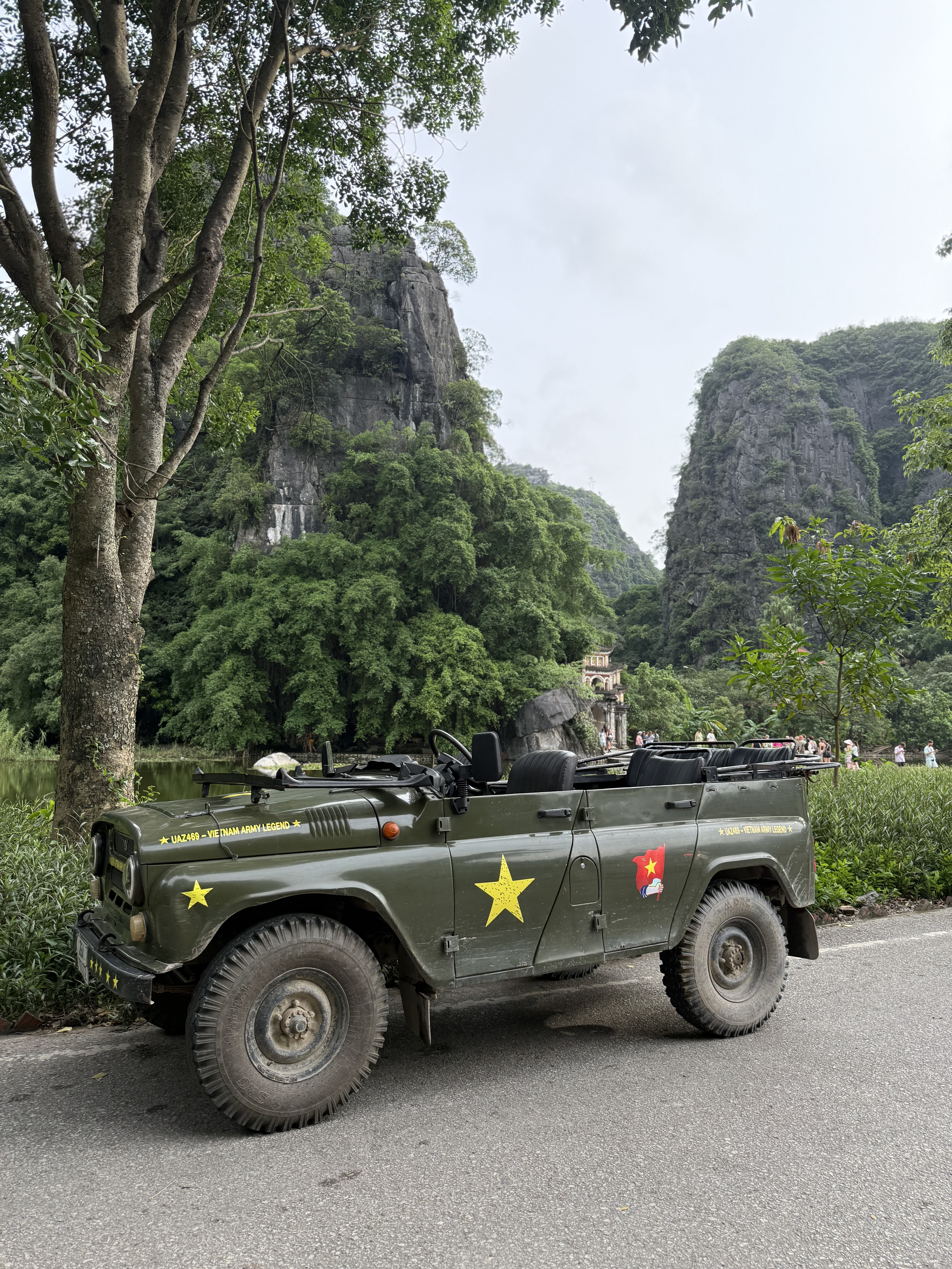 Army-jeep touring the limestone karsts near Trang An, Northern Vietnam