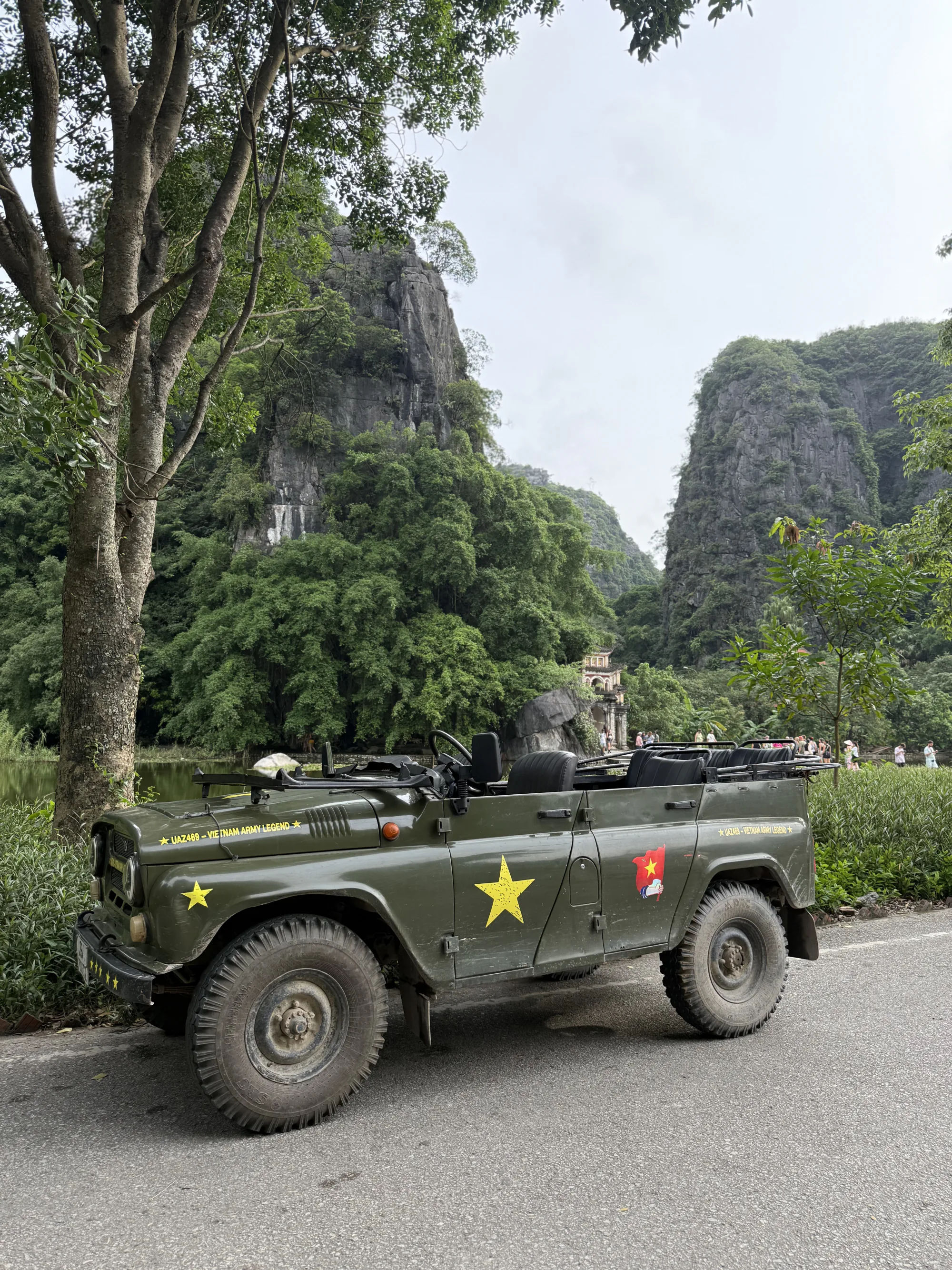 Army-jeep touring the limestone karsts near Trang An, Northern Vietnam