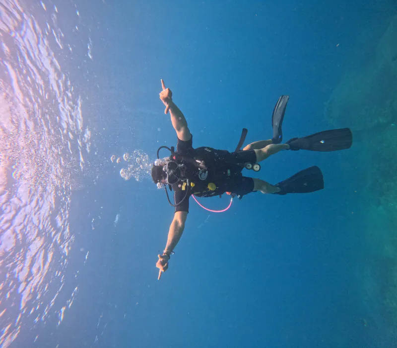 Scuba diver in clear blue water off Bali