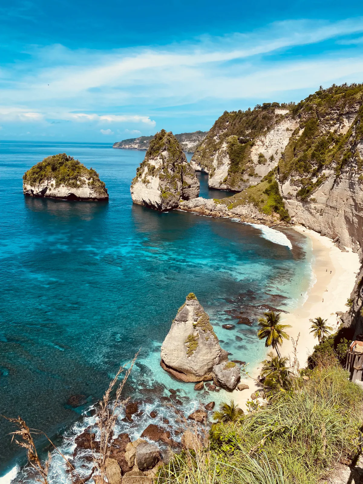 Limestone sea stacks and a white-sand cove at Diamond Beach, Nusa Penida